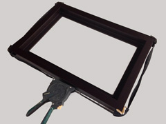 A belt clamp can be wrapped around the frame to hold it tightly in place as the glue dries