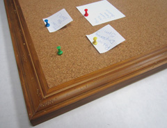A rustic wood frame is well suited to a cork memo board