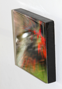 A print mounted on a wood panel, with resin coating and a painted edge