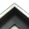 This glossy silver canvas floater frame has a U-shaped scoop face (just over 1/2 " wide) with black distressed scratching. The drop edge is black with a subtle, lined texture.

1-1/2 " rabbet depth: ideal for 1-1/2 " gallery wrapped canvas of medium or large size.  This frame looks equally striking bordering oil or acrylic paint prints and photographic prints.