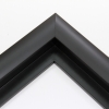 This simple, matte black frame features a thick curved profile.  The slope of the face makes this a simple but glamorous selection. A 1 " rabbet gives this frame a narrow shadow-box quality.

Ideal for medium-sized and large images.  Select an oil or watercolour painting, print, or grayscale photograph.