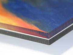 A plexi face mount consists of a photographic print sandwiched between aluminium and plexiglass