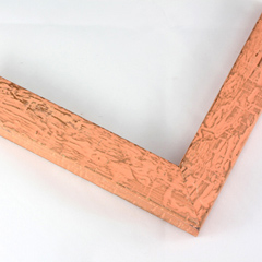 This textured frame features a distressed style and a desert-like finish. The face is a cheerful orange pink, with a medium brown wood finish showing through the distressed surface.