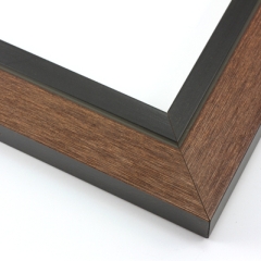 This unique frame with a raw wood face features long edge grain texture and a classic brown wash.  The frame forms a shallow V, with the matte black inner lip sloping out and then rising again (see illustration). The outer drop edge is also matte black.

2 " width: ideal for medium size artwork.  The modern style of this frame makes it a great match to more contemporary paintings and photography.