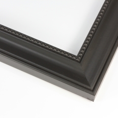 This simple, classic wood frame creates instant elegance with its matte black finish and gentle scoop profile.  Fine beading adorns the inner lip, while the outer edge features a basic bevel.  

2 " width: suitable for large images.  Old black and white photographs, watercolour paintings or prints.