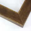 Slightly angled 2-3/8 " frame with an indented design on the inner and outer edge. The face is a cool dark brown stain brushed over a soft gold base. The accented inner and outer edge reveal more of the soft gold color underneath.