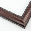This shallow reverse scoop frame features a smooth face in a deep mahogany wash with a subtle view of the natural wood grain. The inner lip is a horseshoe relief design in black, and the black outer edge has a slight bevel.

1.5 " width: ideal for medium size artwork.  The simple elegance of this frame makes it the perfect border for photographs, paintings and giclee prints.