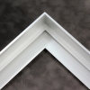1-9/16 " stepped metal floater frame. This frame has a slim face and deep profile. It comes in white silver and features a horizontal brushed texture. Dispersed light is reflected.
