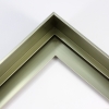 1-9/16" " stepped metal floater frame. This frame has a slim face and deep profile. It comes in sage green and features a horizontal brushed texture. Dispersed light is reflected.