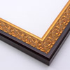 An ornate, solid wood frame featuring an intricate design overlaid with elegant gold leaf, and lightly antiqued.  A shallow scooped profile and unadorned inner edge draw the eye inward. A dark brown outer edge highlights the design.  

1.75 " width: ideal for medium-sized artworks.  Oil paintings, prints and formal family photos will be equally at home encased in this traditional frame.
