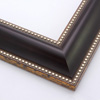 This striking, reverse scoop profile frame features a matte, deep brown face with silver foil beading on the inner and outer edges.  The drop edge of the inner lip is a subtle gold foil. Solid wood.

2.125 " width: ideal for medium and large images.  Add some elegance to a family portrait, or border an old oil painting or Giclée print with this simple, fashionable frame.